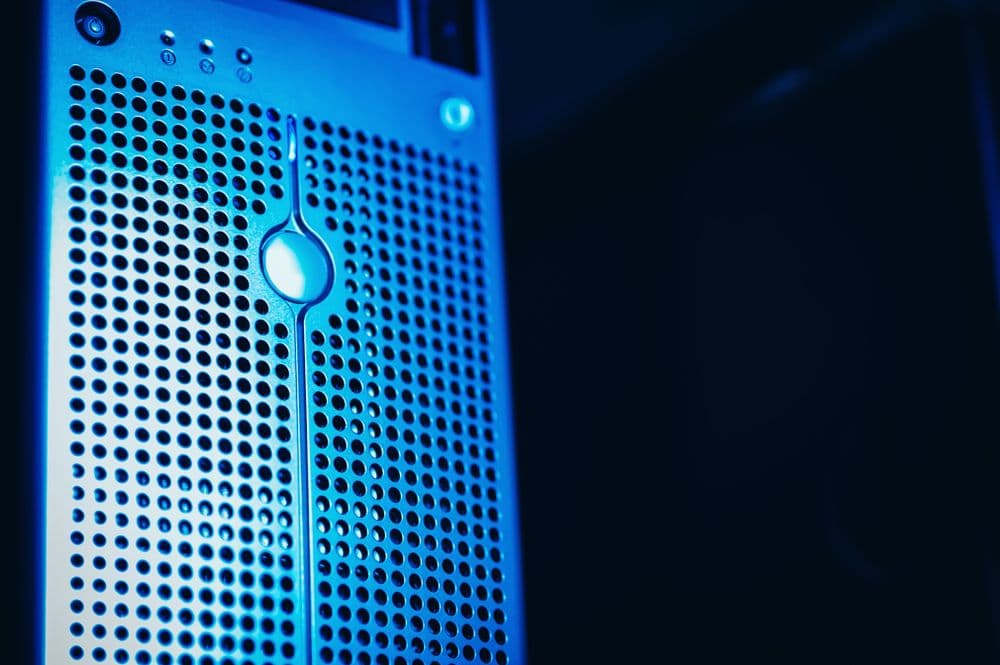 Close-up of a blue-lit server rack inside a data centre