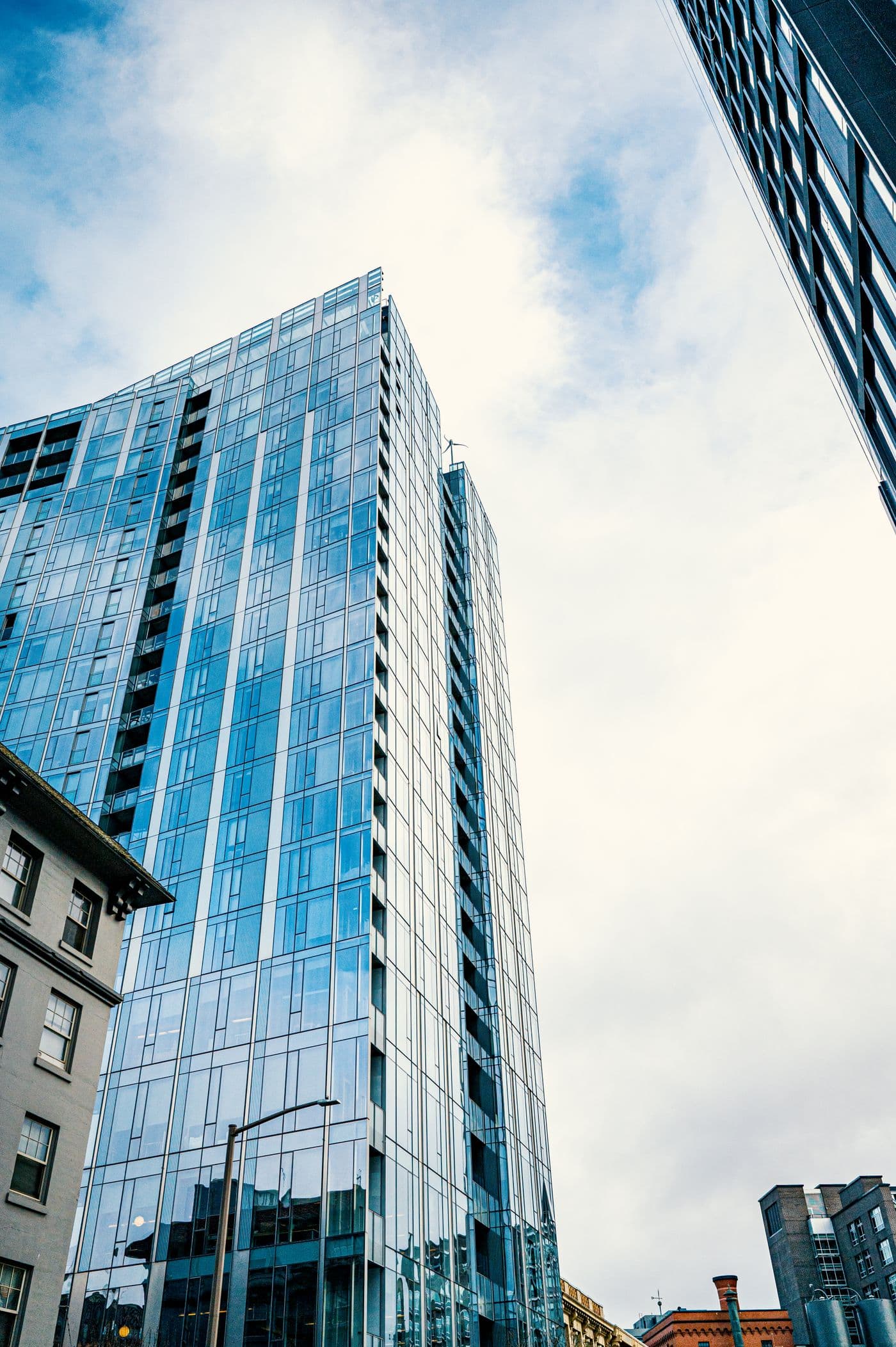 Upward view of a glass residential and office tower