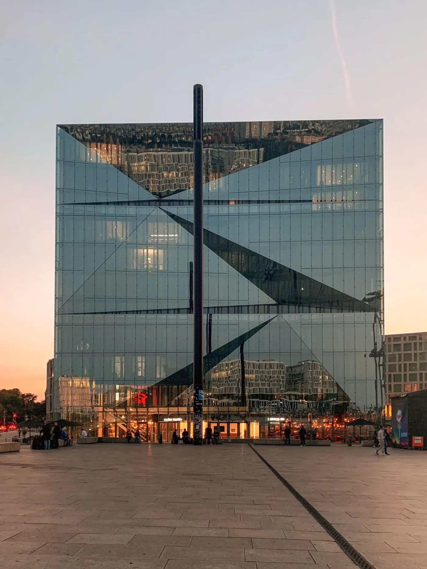 Glass corporate tower at dusk